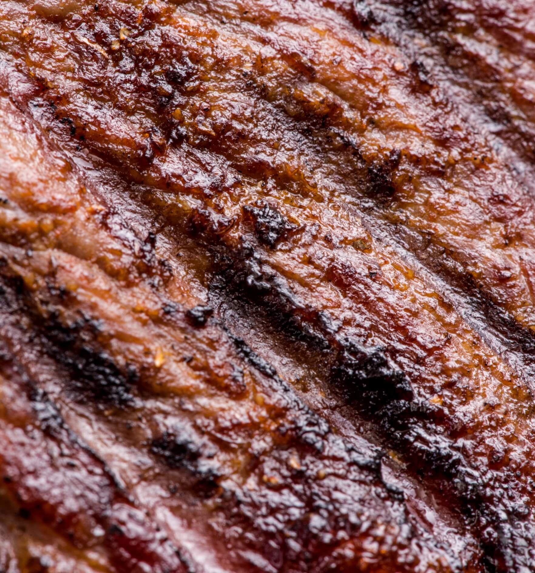 Image showing a big juicy grilled beef steak close up