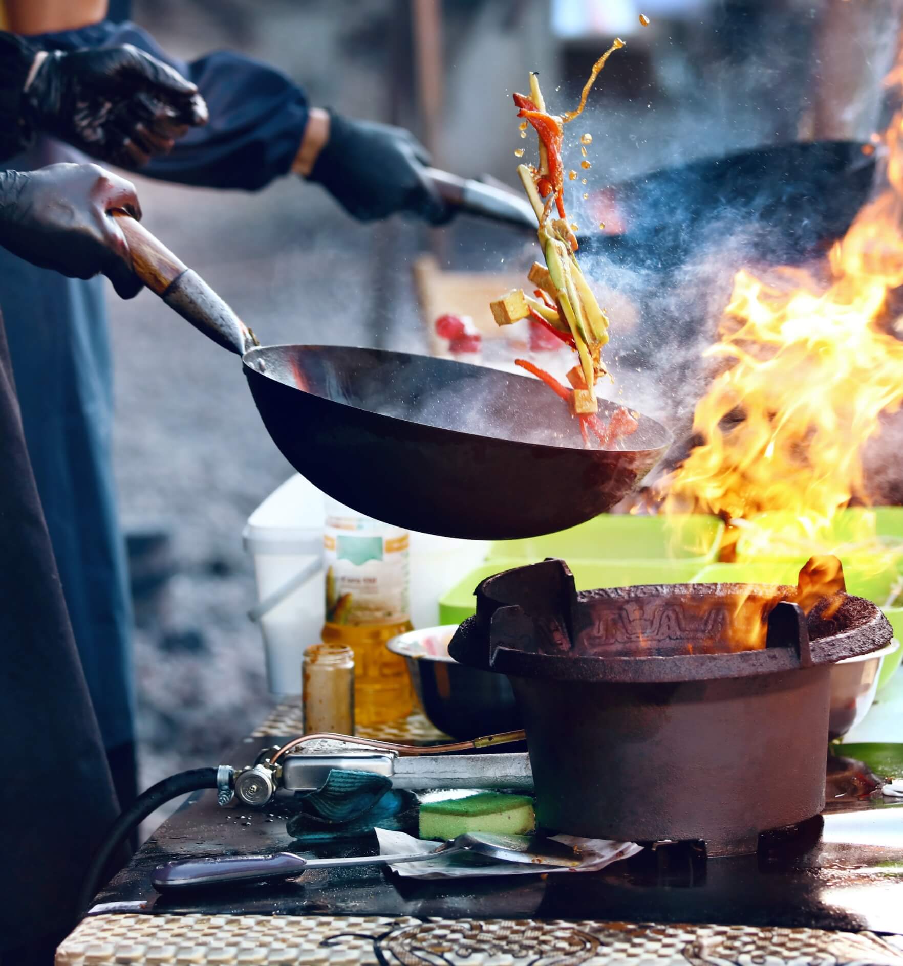 Image showing a person cooking food on fire on street festival