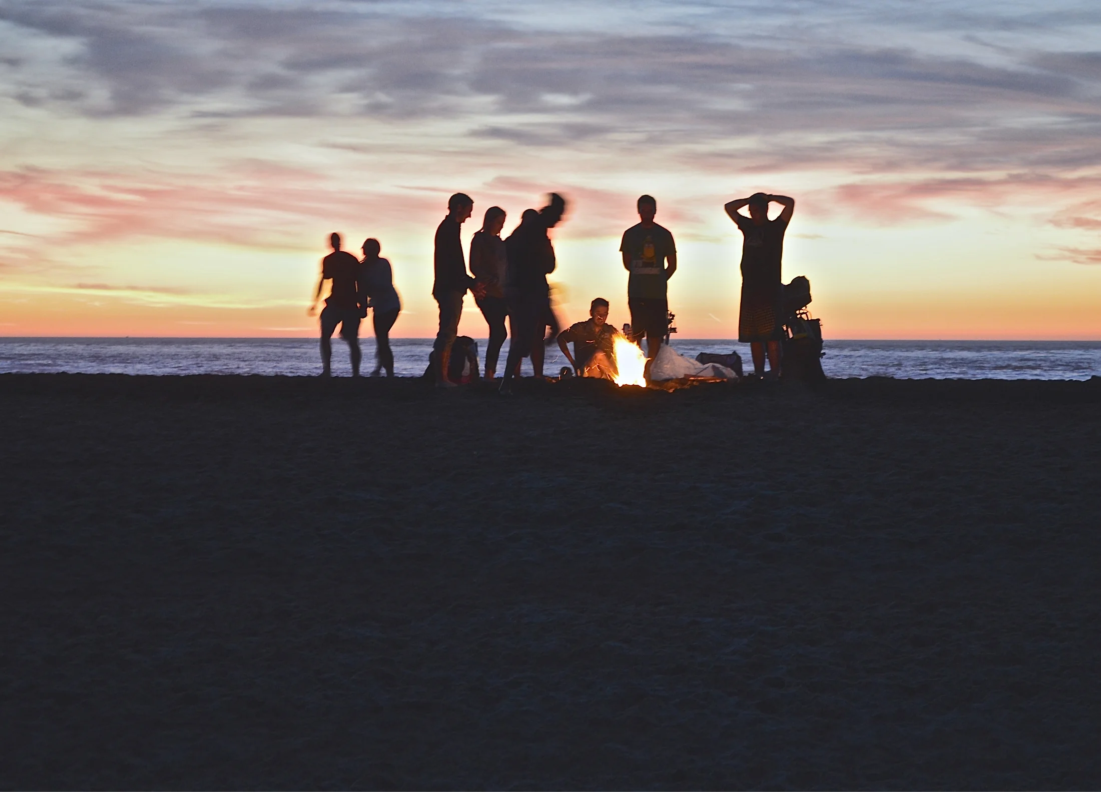 Image showing friends having a bonfire on the beach
